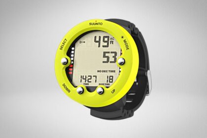 Suunto Zoop Novo dive computer with a lime bezel and black strap, display reading 49 ft
