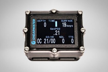 Shearwater Petrel dive computer in a metal frame, colour screen showing depth, gas mix and NDL