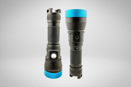 Kraken NR 2000 dive light shown from both sides, black body with blue accent rings and a recessed side switch