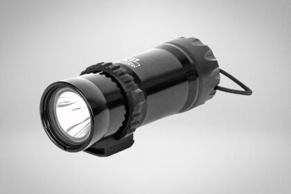 Dive Rite LX20 compact dive light in black with a toothed bezel ring, wrist lanyard and small side mount foot