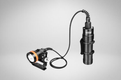 Orcatorch D630 canister dive light with an orange and black light head, handle mount and corded battery canister