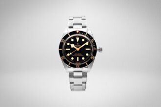 Tudor Black Bay Fifty-Eight dive watch with black dial and bezel, gilt hour markers and steel bracelet