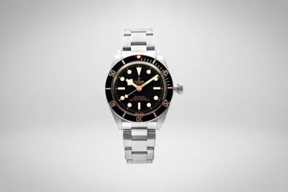 Tudor Black Bay Fifty-Eight dive watch with black dial and bezel, gilt hour markers and steel bracelet