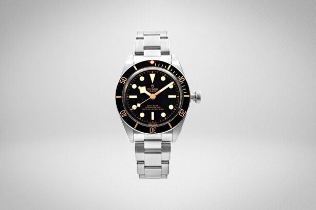 Tudor Black Bay Fifty-Eight dive watch with black dial and bezel, gilt hour markers and steel bracelet