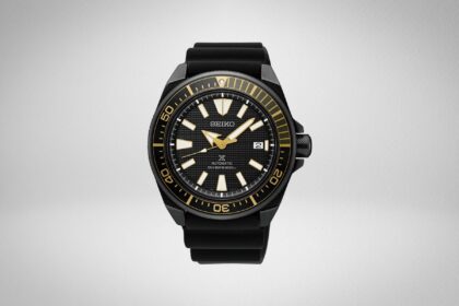 Seiko Prospex automatic diver with black case, gold trimmed bezel and black rubber strap