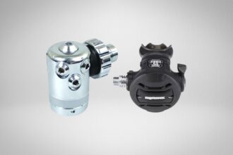Apeks XTX40 regulator set with chrome first stage and black second stage on a grey studio background