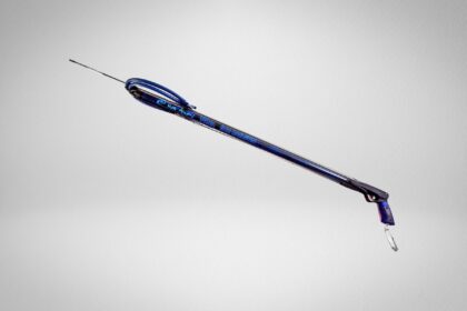 Rob Allen Tuna railgun at an angle, blue barrel with looped rubber bands and slim spear