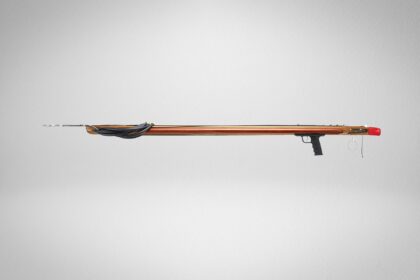 Riffe Bluewater Elite wooden speargun in side profile with bands rigged and spear shaft loaded