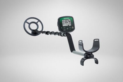 Teknetics Delta 4000 metal detector with green backlit display, round search coil and open armrest