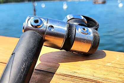Close-up of the Atomic Aquatics TFX first stage on a wooden dock during DIVEIN testing