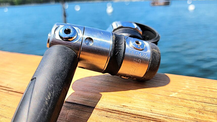 Close-up of the Atomic Aquatics TFX first stage on a wooden dock during DIVEIN testing