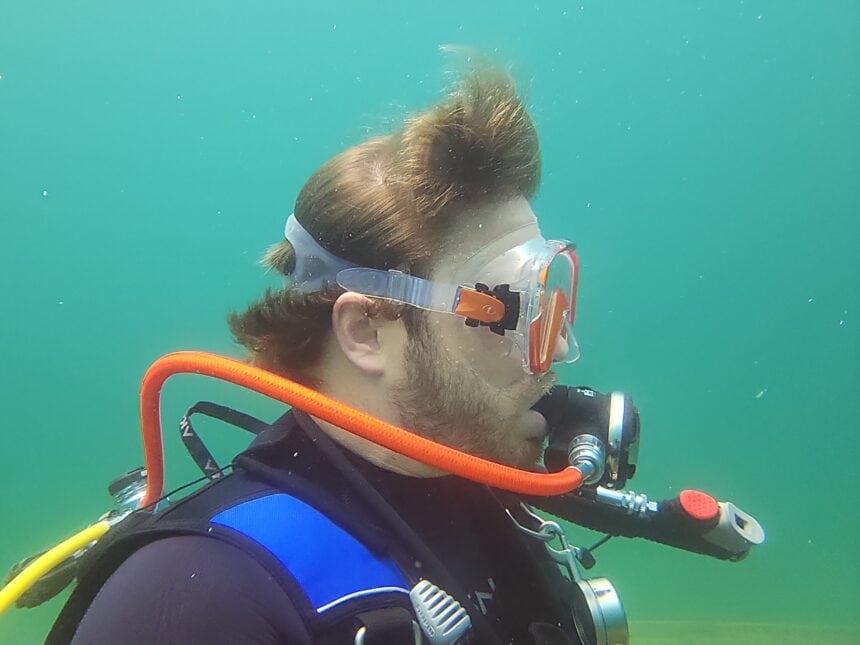 Our tester in profile underwater with the TUSA Freedom Elite sealed over his beard