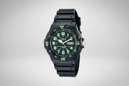 Casio MRW200H analog watch with black resin strap and green numerals on a plain grey background