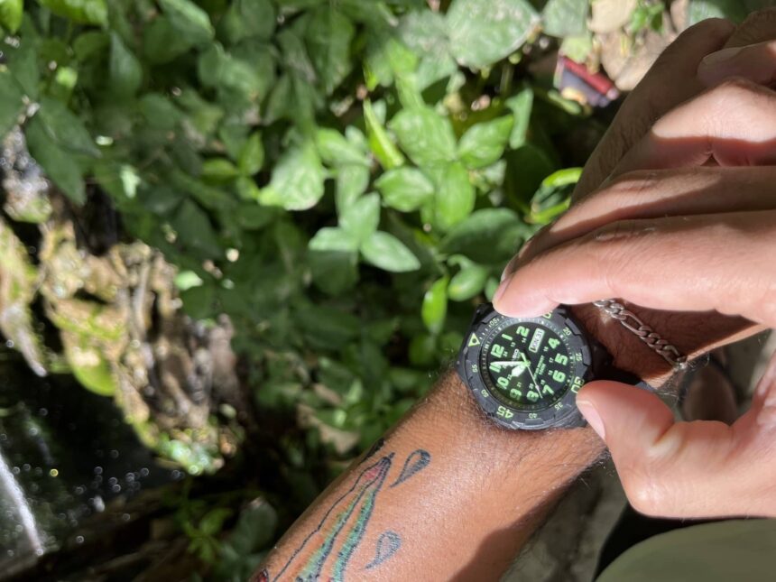 Our reviewer turning the bezel of the Casio MRW200H while wearing it outdoors