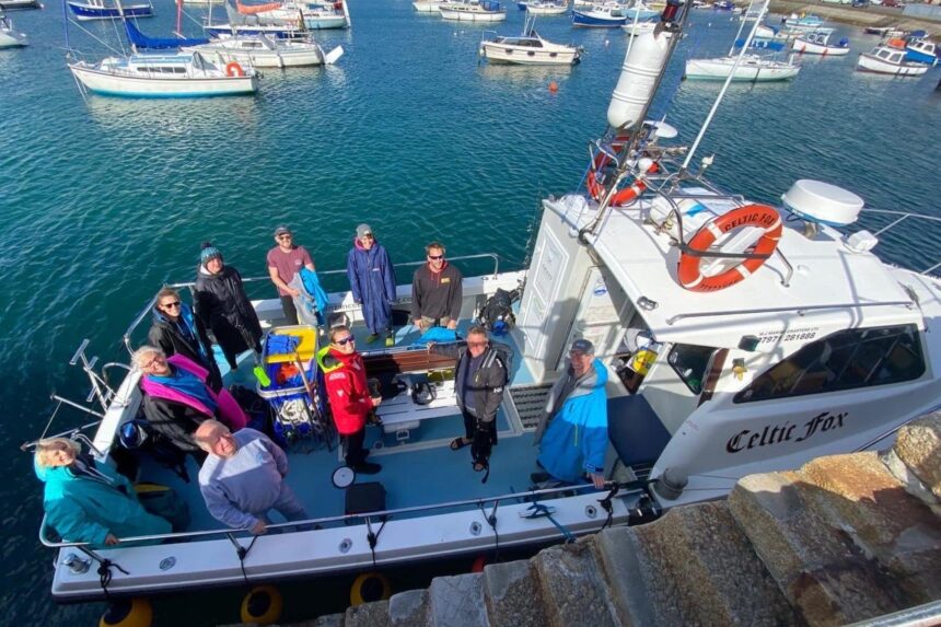 Celtic Fox Boat Group Group of snorkelers posing aboard the Celtic Fox in harbor