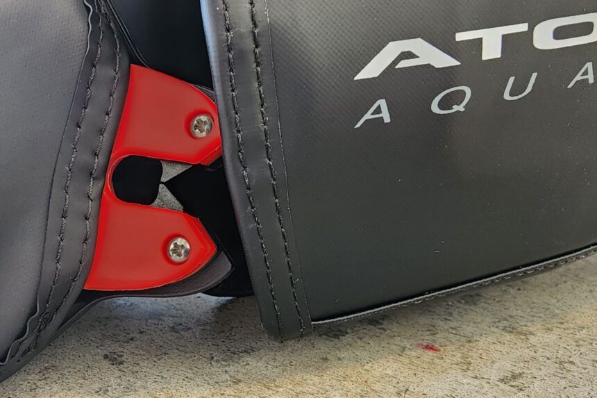 Red release latch hardware on the integrated weight pocket of the Atomic Aquatics BC2
