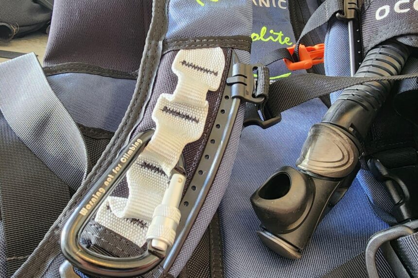 Stainless carabiner and woven keeper clipped to the shoulder strap of the Oceanic Biolite