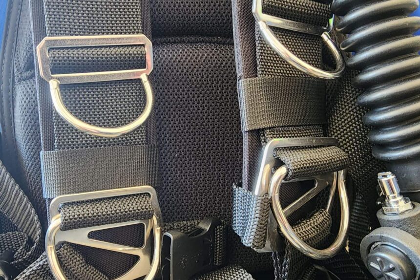 Stainless steel D-rings threaded onto the harness webbing of the Dive Rite Hydro Lite
