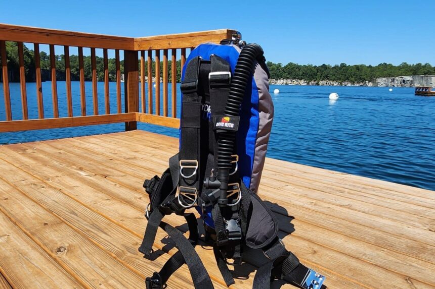 Rear view of the Dive Rite Hydro Lite wing and shoulder harness on a sunlit lake dock