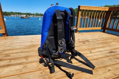 Dive Rite Hydro Lite soft backplate wing BCD standing on a lake dock during DIVEIN testing