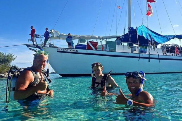 Divers giving thumbs up in the water near Blackbeard's Sea Explorer