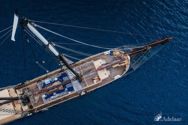aerial view looking down on the Adelaar's deck and rigging at anchor