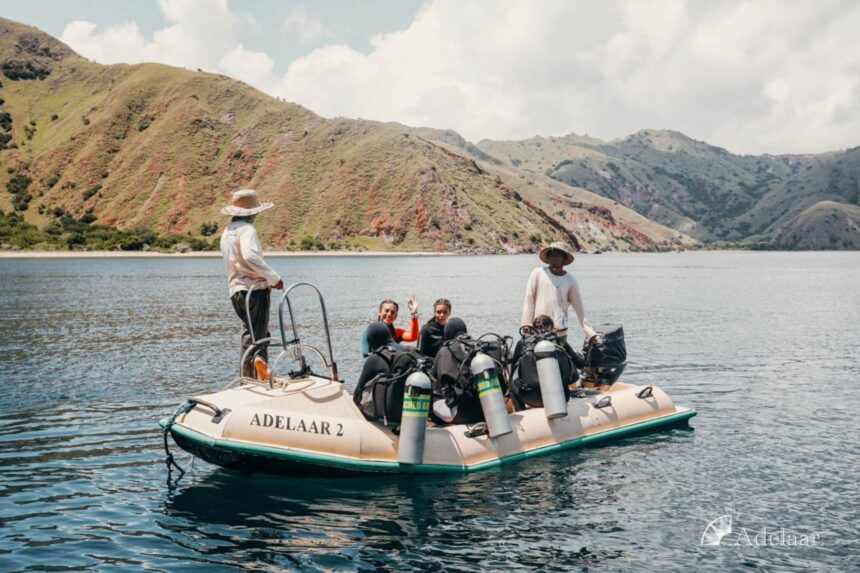 divers and crew loading gear onto the Adelaar 2 tender boat