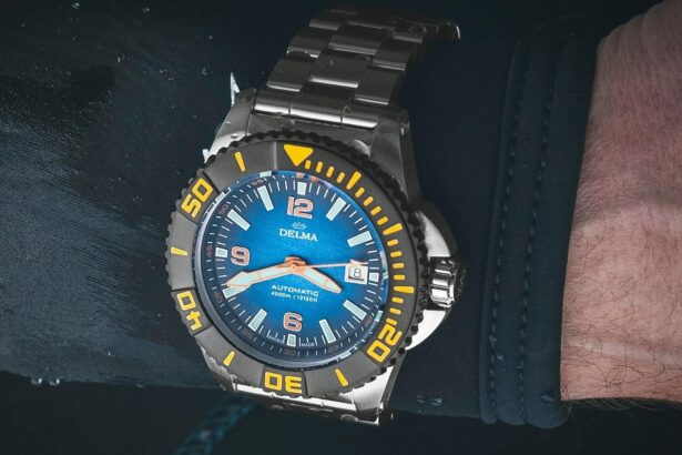 DIVEIN tester wearing the Delma Blue Shark automatic dive watch on a wrist resting on a wetsuit