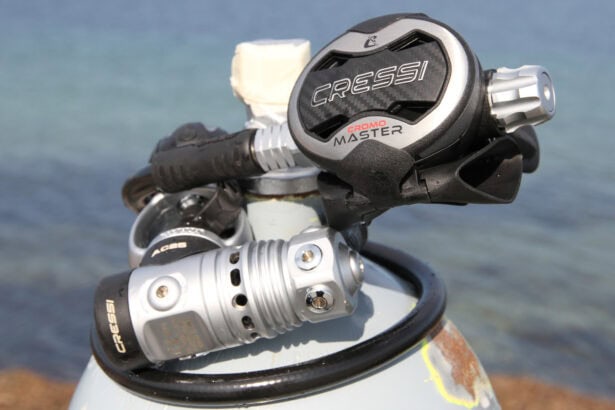 Cressi AC25 Master Cromo regulator mounted on a cylinder valve with the sea behind it