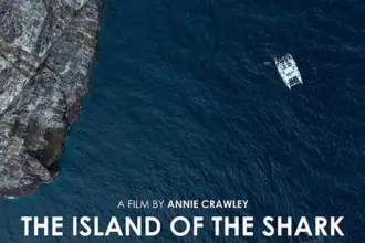 poster for the documentary Island of the Shark, Guardians of Malpelo, boat off towering cliffs