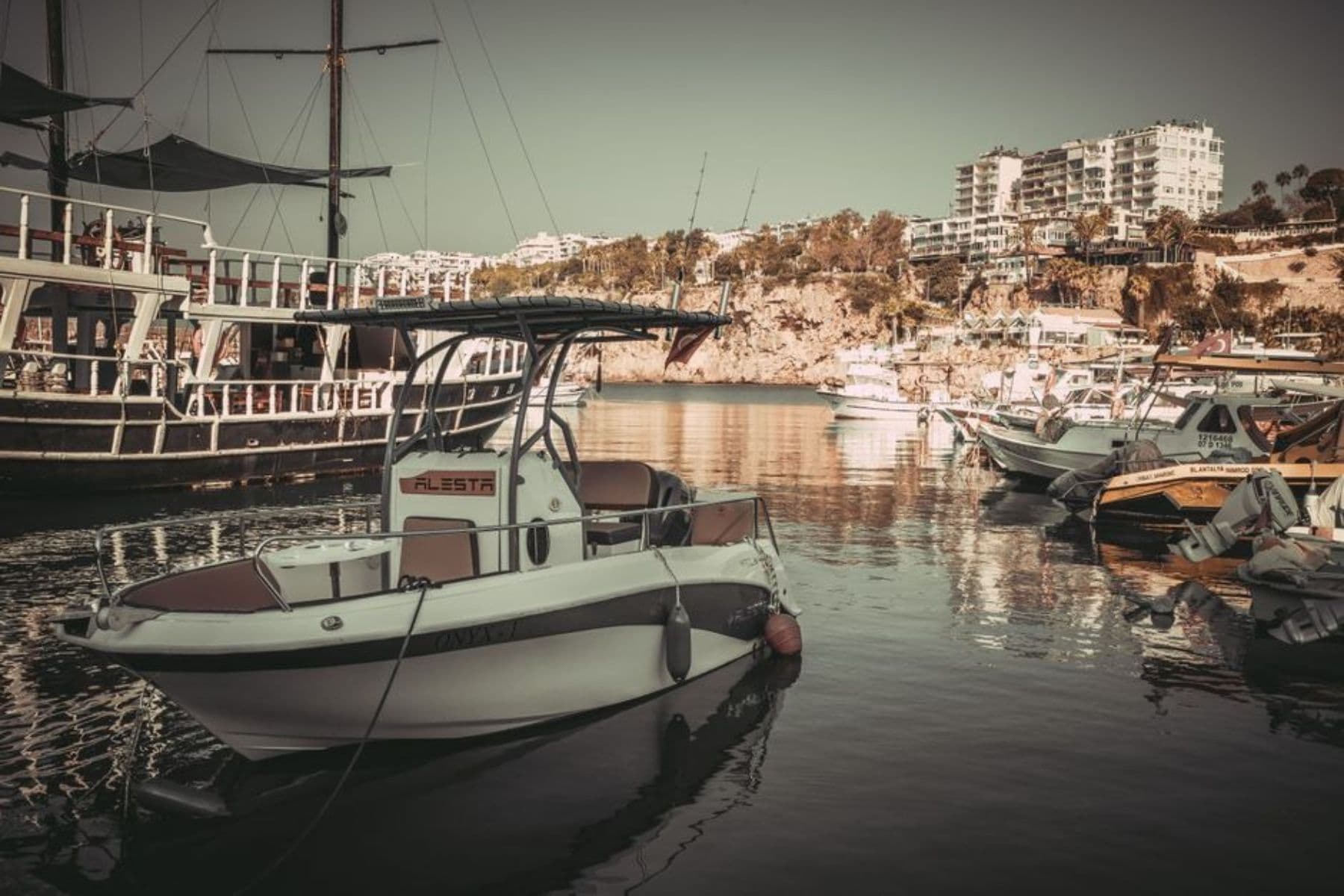 A center console boat at a marina dock