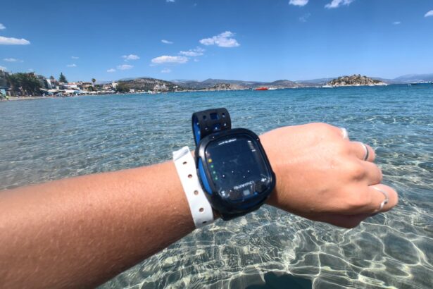 Cressi Da Vinci dive computer worn on the wrist with a shoreline in the background