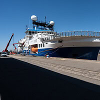 Research vessel Falkor (too) alongside a quay
