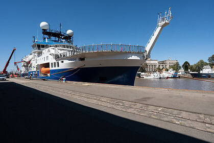 Research vessel Falkor (too) alongside a quay