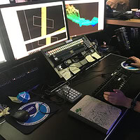 Explorer-in-Training Cassie Ferrante working with multibeam sonar data on a research ship