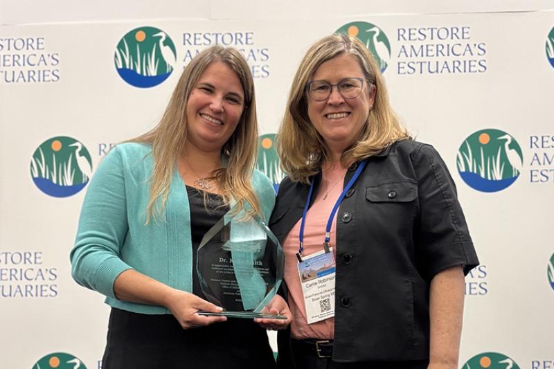Kylie Smith with NOAA habitat conservation director Carrie Robinson at the Coastal and Estuarine Summit